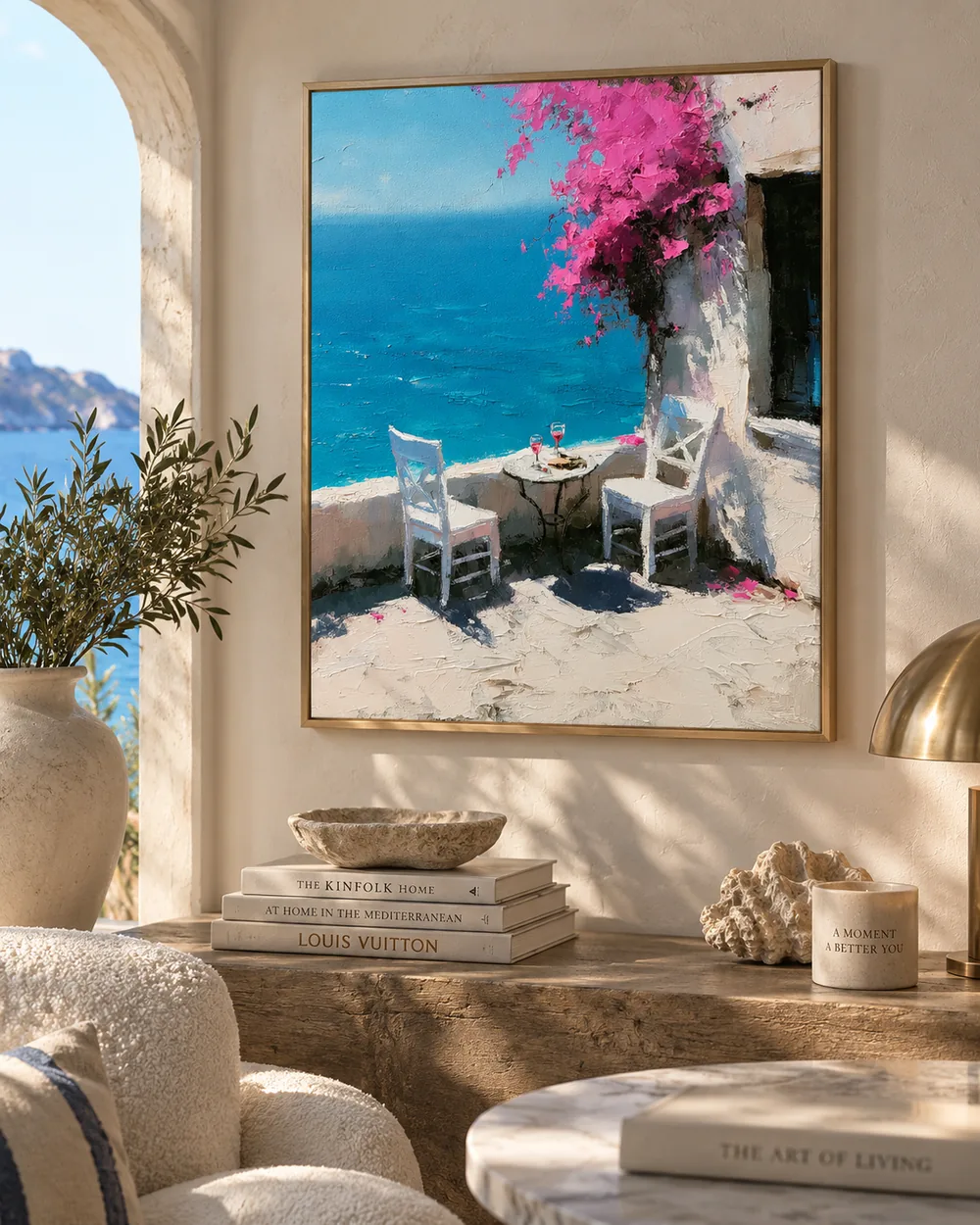 An oil painting hanging above a sofa in a bright room
